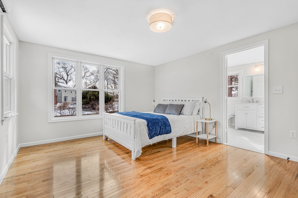 4 Retrop Road Natick, MA 01760 - Photo 14 of 26 a bedroom with a bed and a window