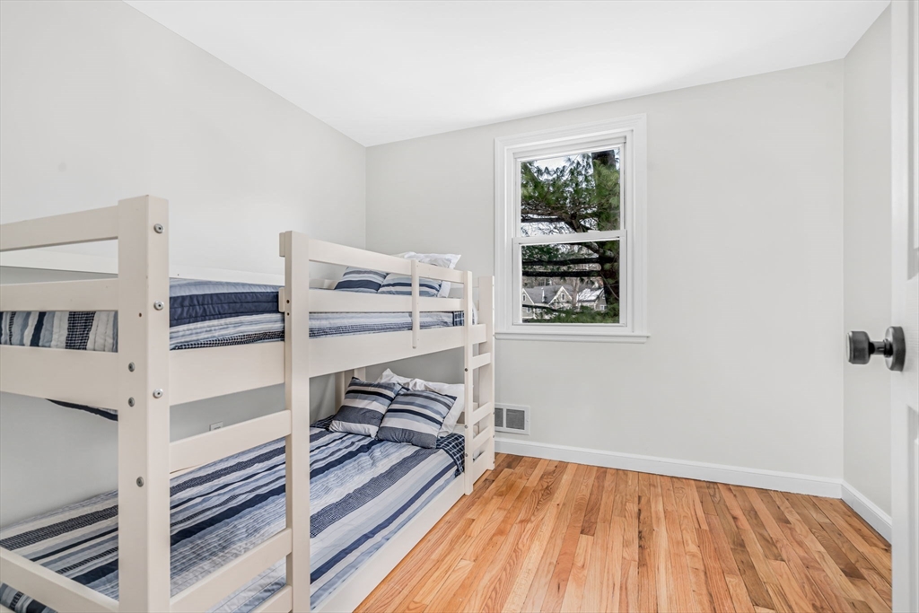 4 Retrop Road Natick, MA 01760 - Photo 17 of 26 a view of a room with racks on the wall