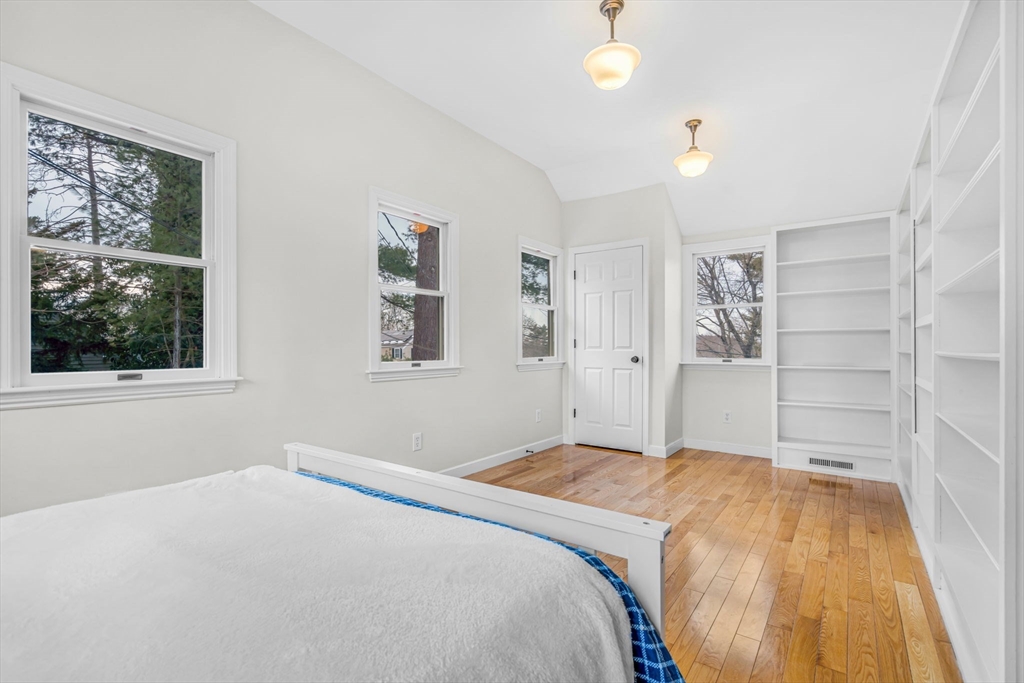 4 Retrop Road Natick, MA 01760 - Photo 20 of 26 a bedroom with a bed and a window