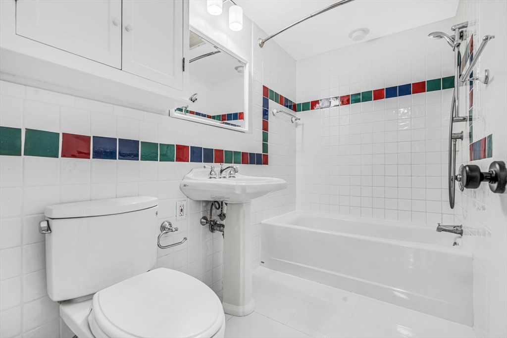 4 Retrop Road Natick, MA 01760 - Photo 22 of 26 a bathroom with a sink toilet and shower