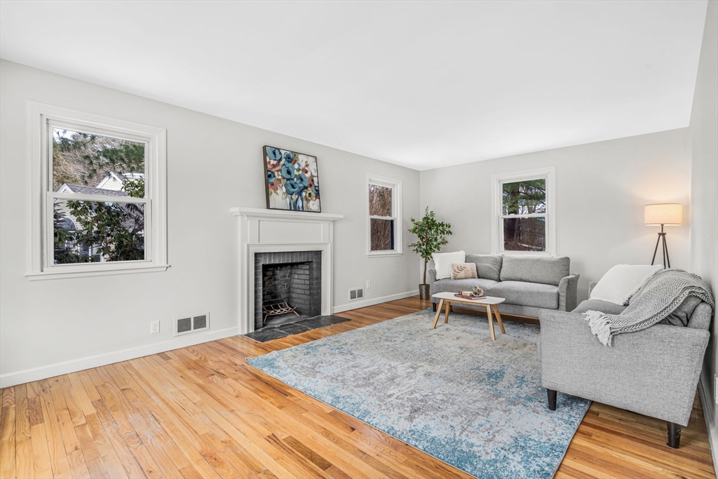 4 Retrop Road Natick, MA 01760 - Photo 5 of 26 a living room with furniture and a fireplace