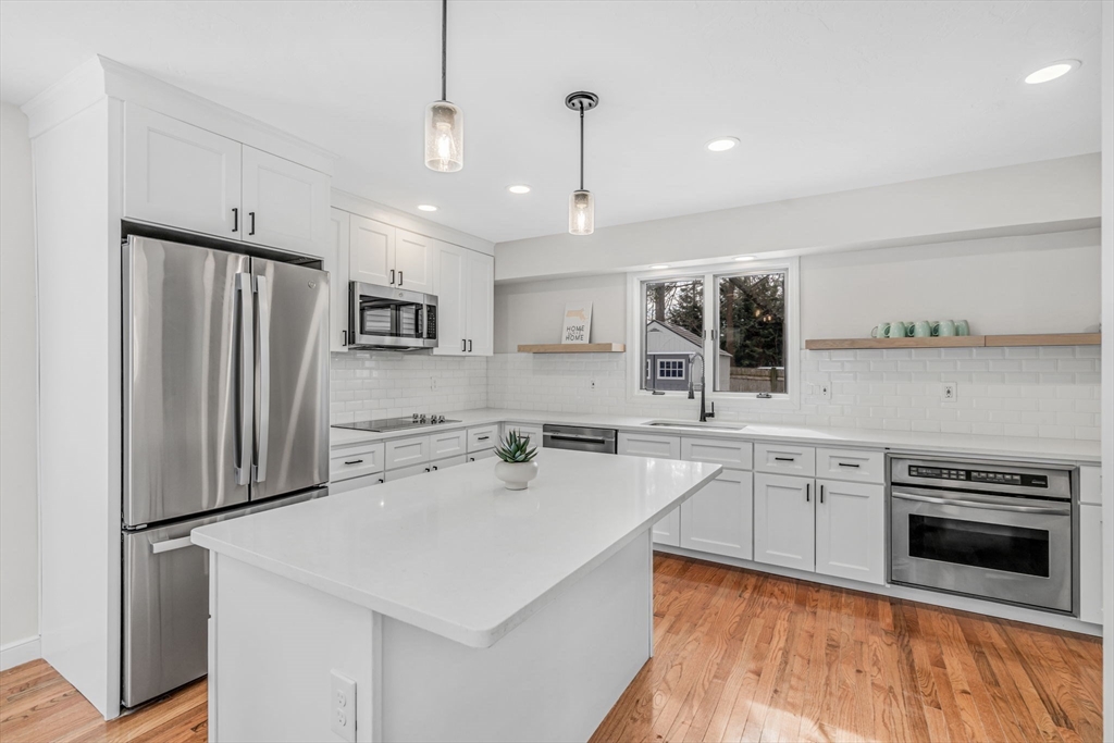 4 Retrop Road Natick, MA 01760 - Photo 7 of 26 a kitchen with stainless steel appliances a refrigerator sink and stove