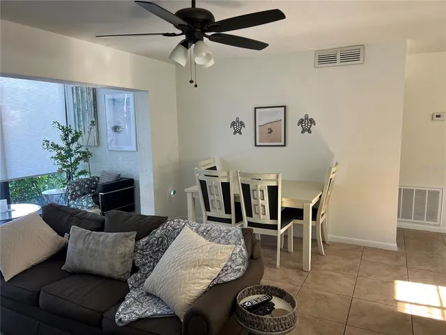 a living room with furniture and a window