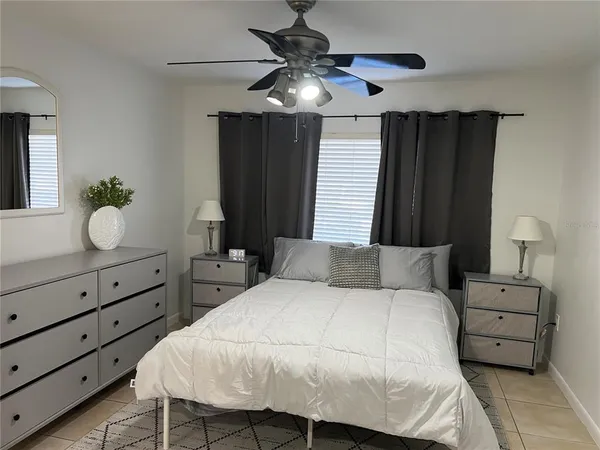 a bedroom with a bed and a dresser