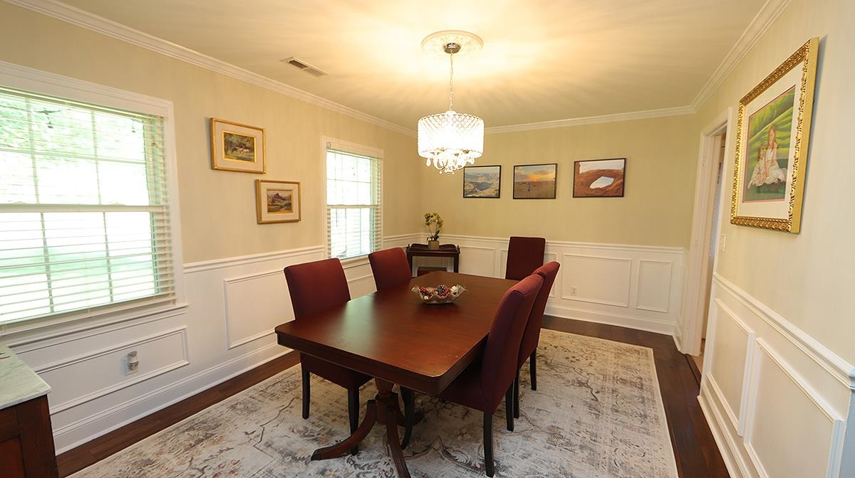 3016 Old Orchard Road Raleigh, NC 27607 - Photo 6 of 39 Gorgeous Hardwoods and Fresh Trim Details in this Spacious Dining Room with Front Yard Views. Perfect for Entertaining Guests & Family for those Special Occasions. Formal Dining Room