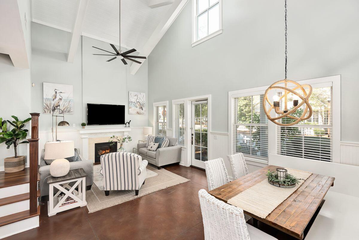 220 Salt Lane Watersound, FL 32461 - Photo 11 of 35 a living room with furniture a flat screen tv and a window