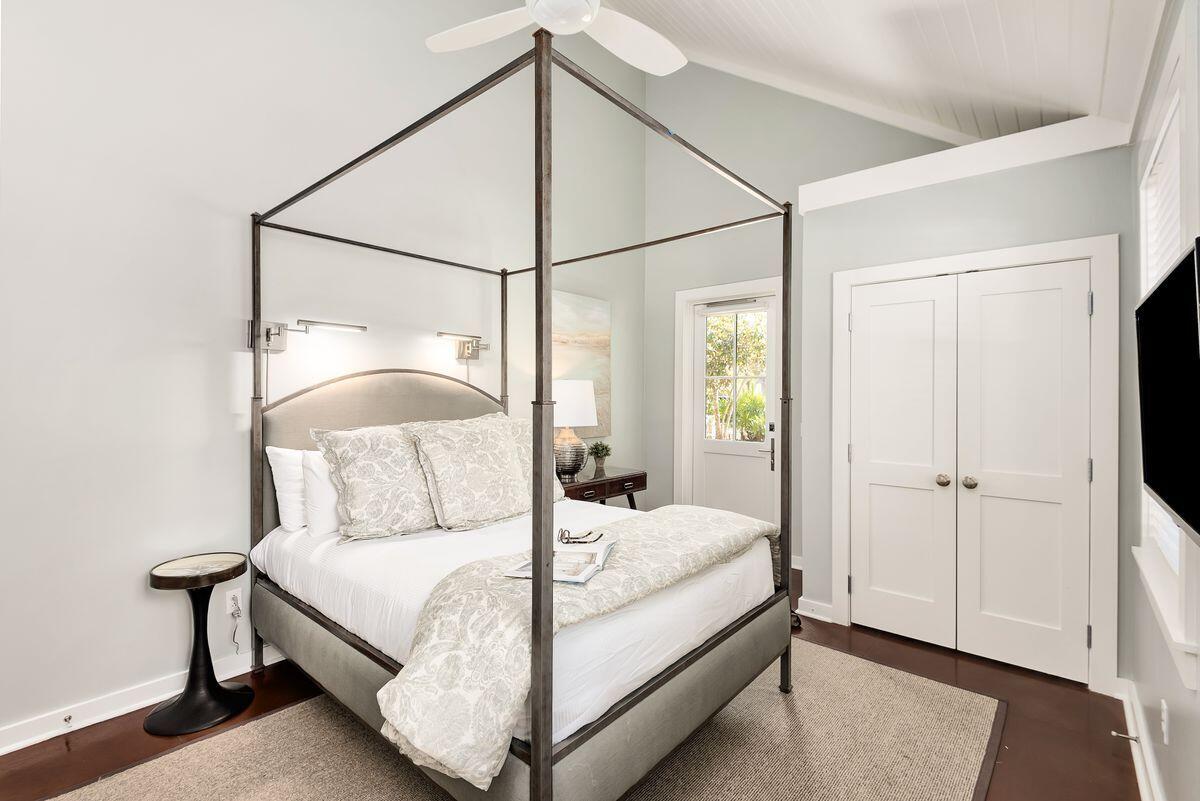 220 Salt Lane Watersound, FL 32461 - Photo 14 of 35 a bedroom with a bed and a mirror