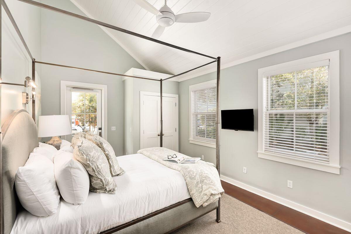 220 Salt Lane Watersound, FL 32461 - Photo 16 of 35 a bedroom with a bed and a large window