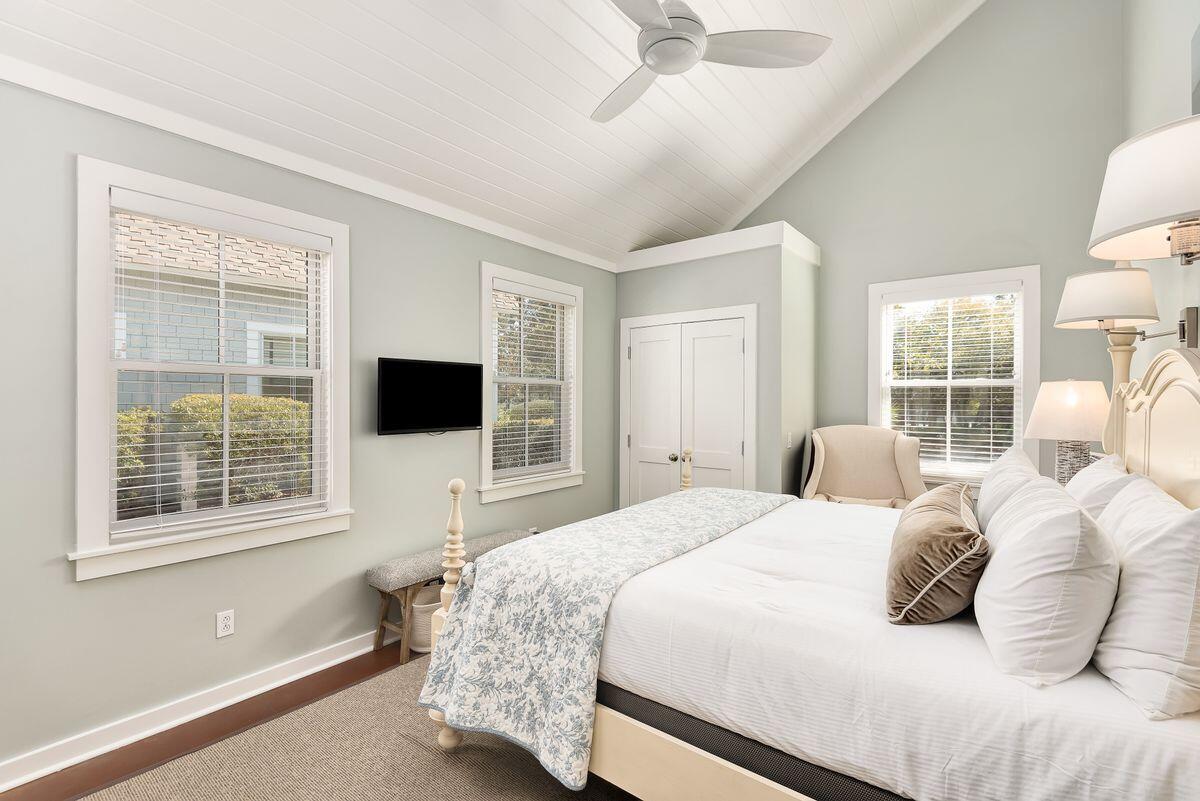 220 Salt Lane Watersound, FL 32461 - Photo 20 of 35 a bedroom with a bed and a television