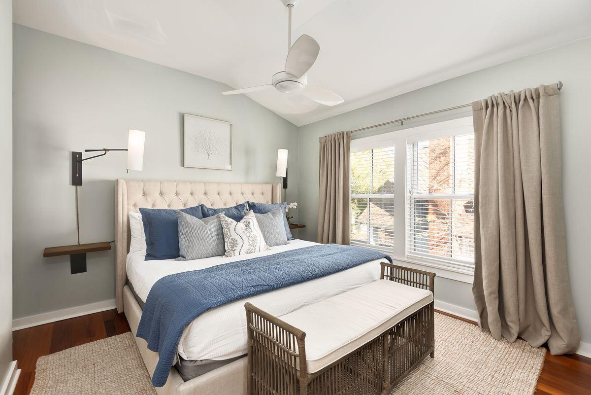 220 Salt Lane Watersound, FL 32461 - Photo 22 of 35 a bedroom with a large bed and a window