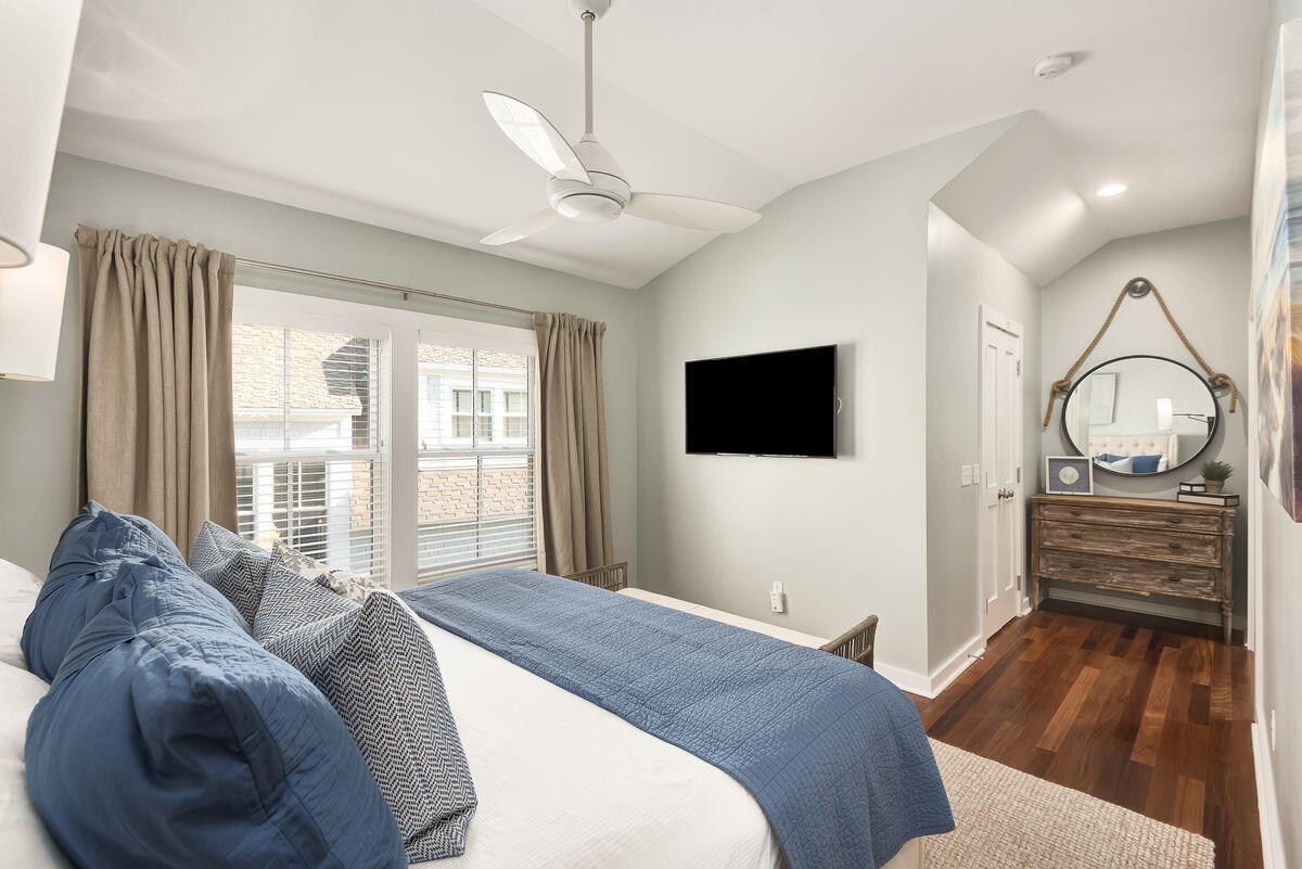 220 Salt Lane Watersound, FL 32461 - Photo 23 of 35 a bedroom with a bed and a flat screen tv