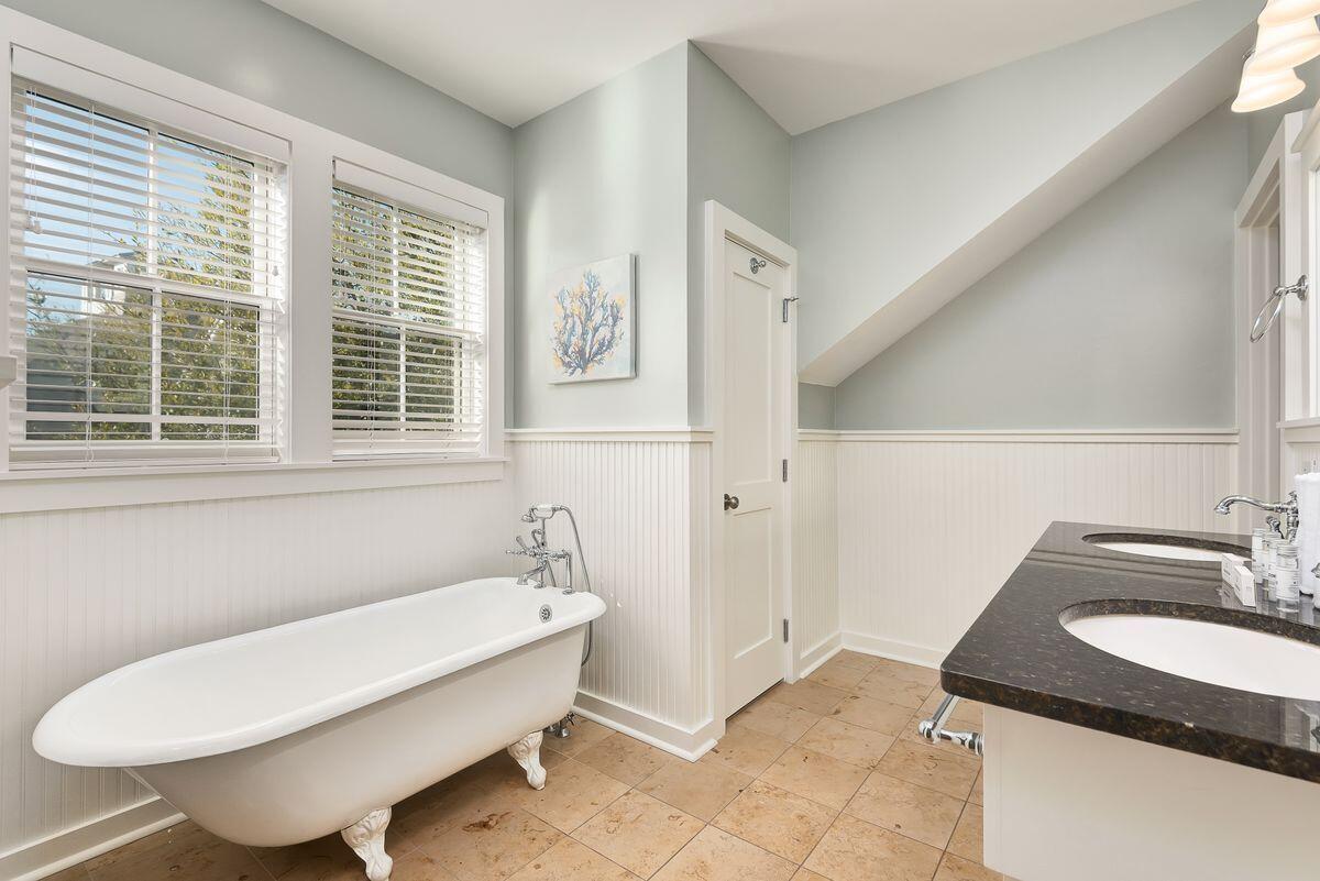 220 Salt Lane Watersound, FL 32461 - Photo 26 of 35 a bathroom with a granite countertop sink and a bathtub