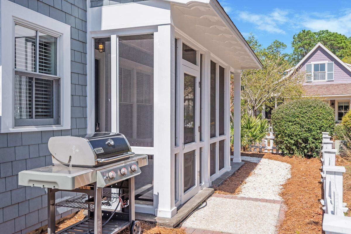 220 Salt Lane Watersound, FL 32461 - Photo 34 of 35 a backyard of a house with table and chairs