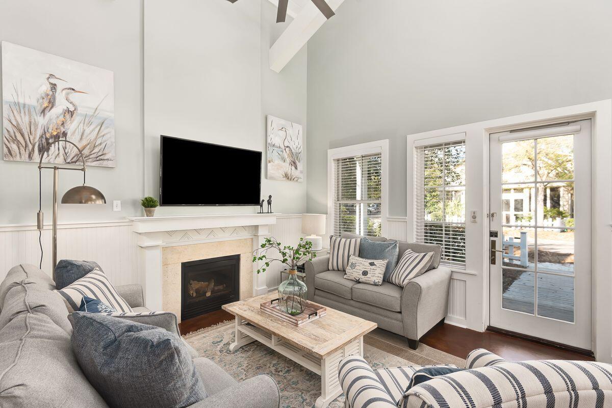 220 Salt Lane Watersound, FL 32461 - Photo 7 of 35 a living room with furniture a fireplace and a flat screen tv