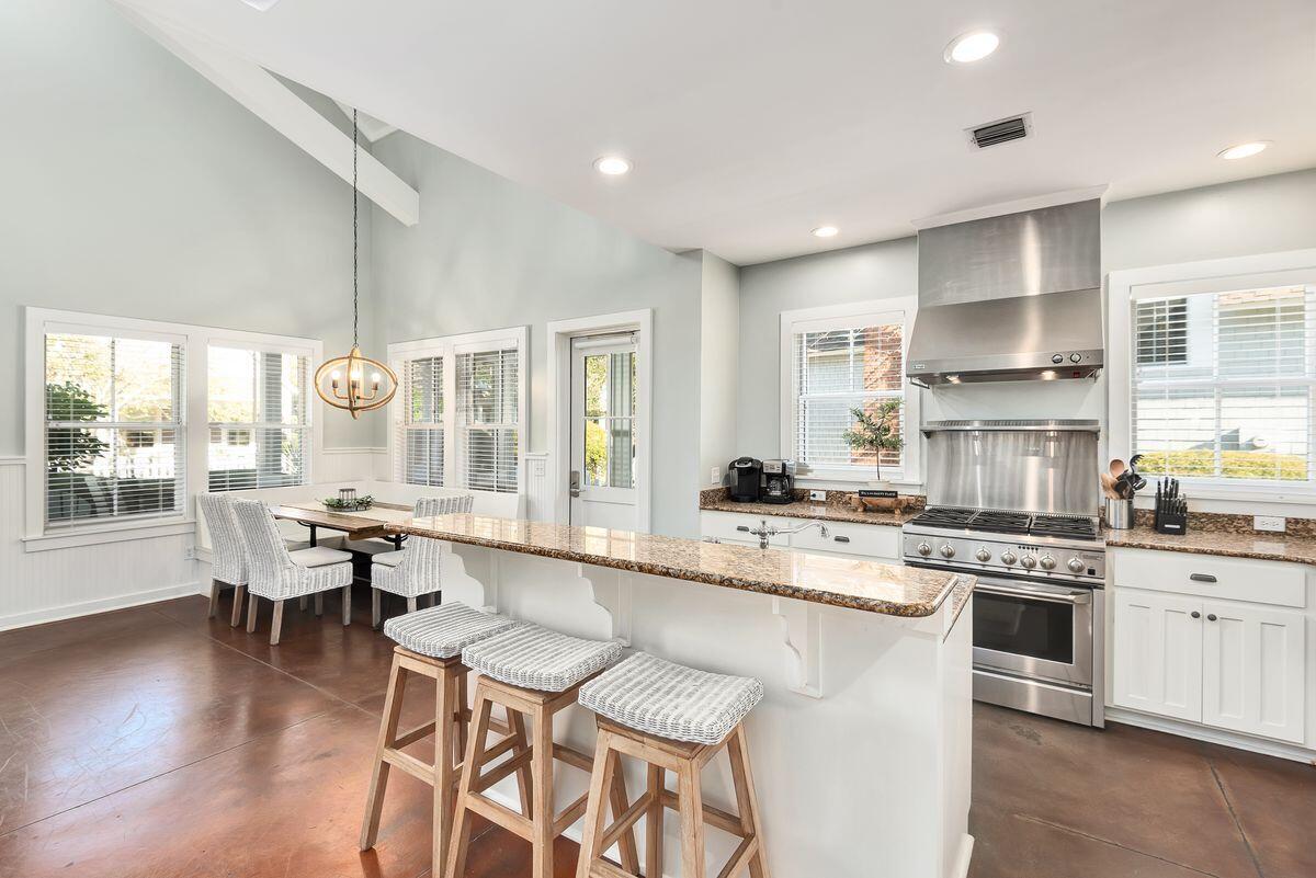 220 Salt Lane Watersound, FL 32461 - Photo 10 of 35 a large kitchen with a table and chairs in it