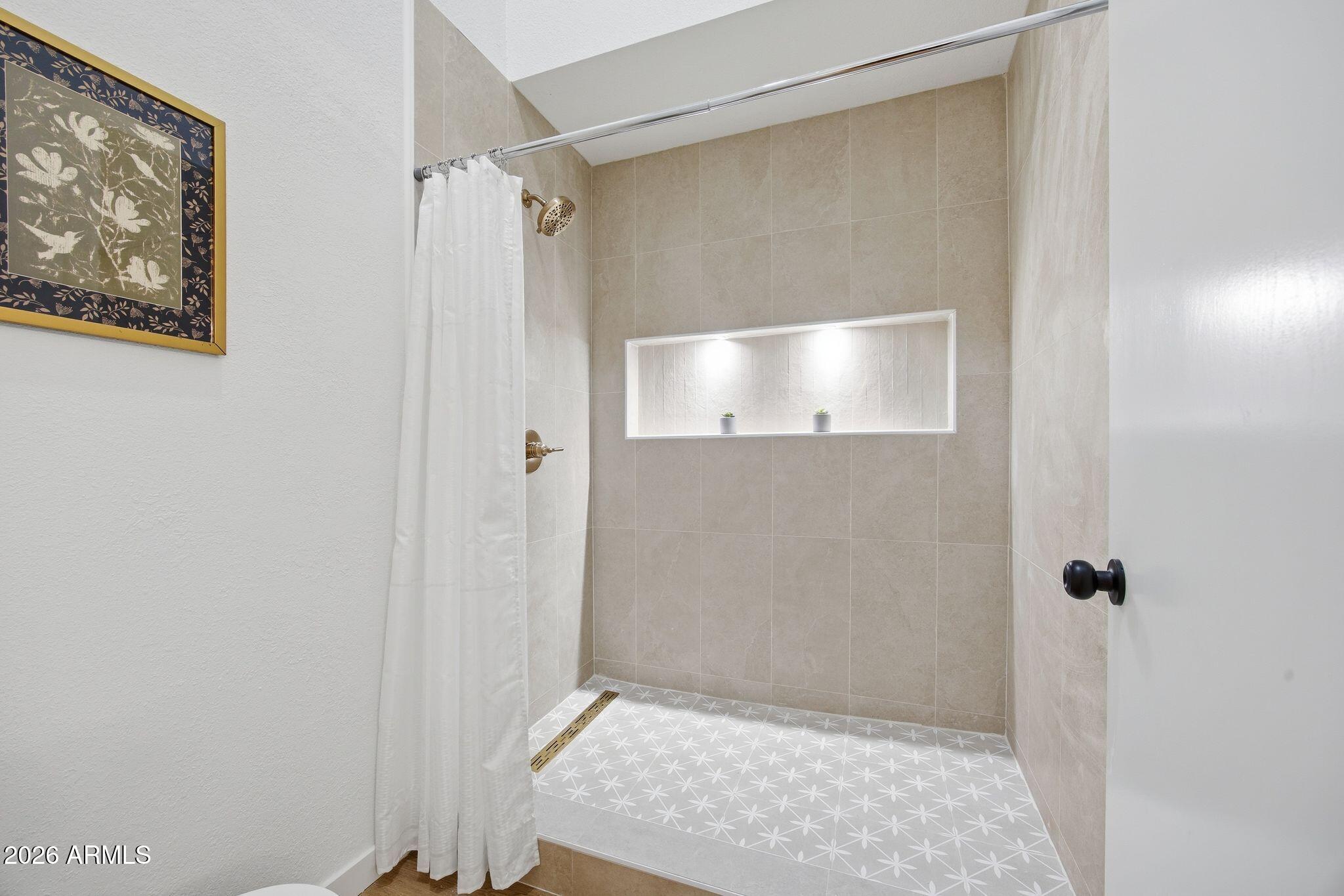 3134 East McKellips Road, Unit 69 Mesa, AZ 85213 - Photo 15 of 24 a bathroom with a shower and a glass door