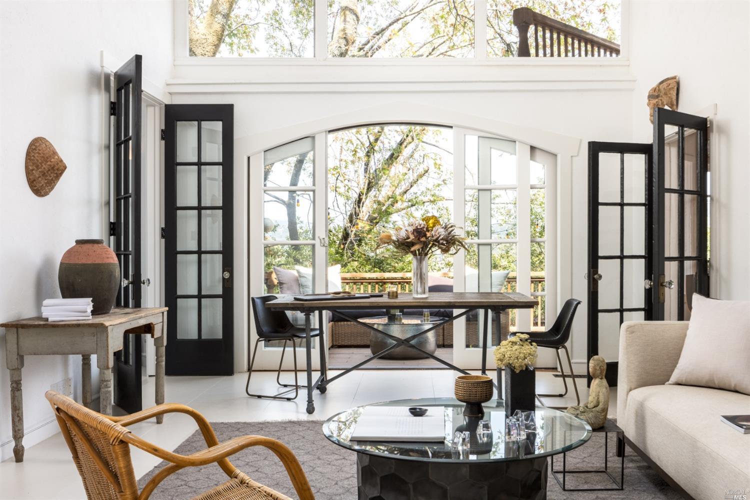 240 Scenic Road Fairfax, CA 94930 - Photo 1 of 1 a dining room with furniture and wooden floor