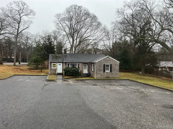 a house with trees in front of it