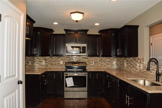 22 Salem Ridge Road Clarksville, TN 37040 - Photo 7 of 20 GRANITE TOPS IN KITCHEN, REAL HARDWOOD, STAINLESS APPLIANCES, CUSTOM BACKSPLASH! LOTS OF CUSTOM CABINETRY & COUNTER SPACE FOR THE COOK!