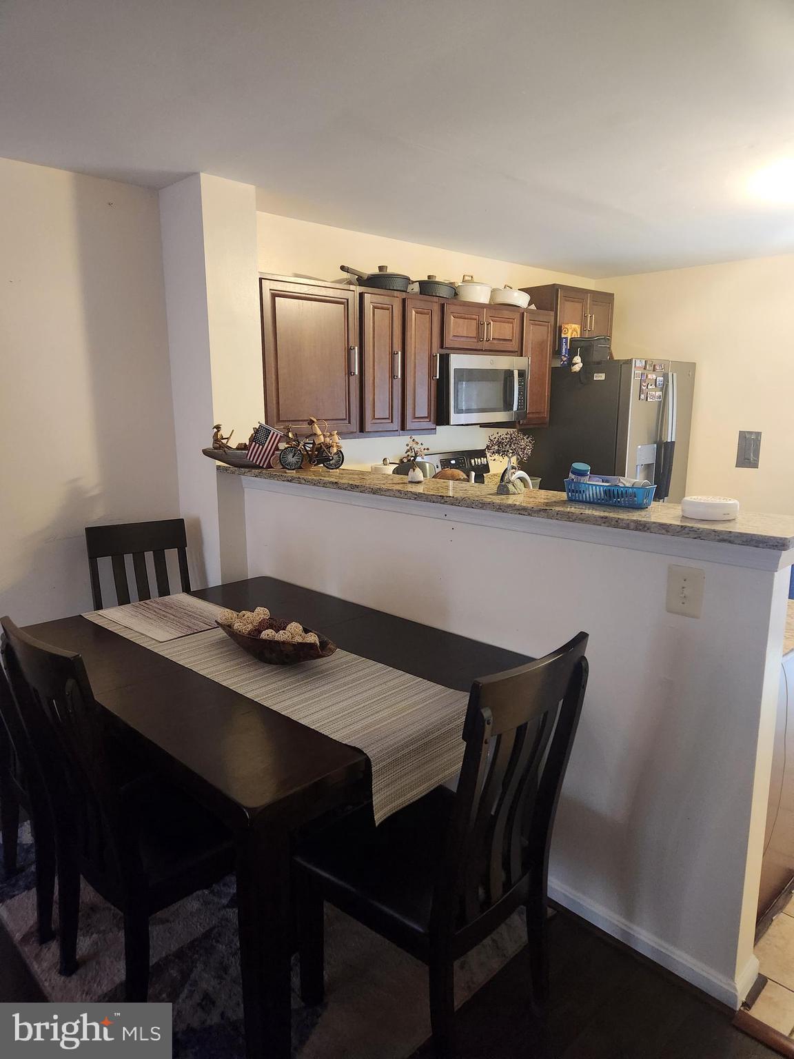 12912 Boggy Trail Way, Unit 55 Germantown, MD 20876 - Photo 13 of 27 a dining room with furniture and window