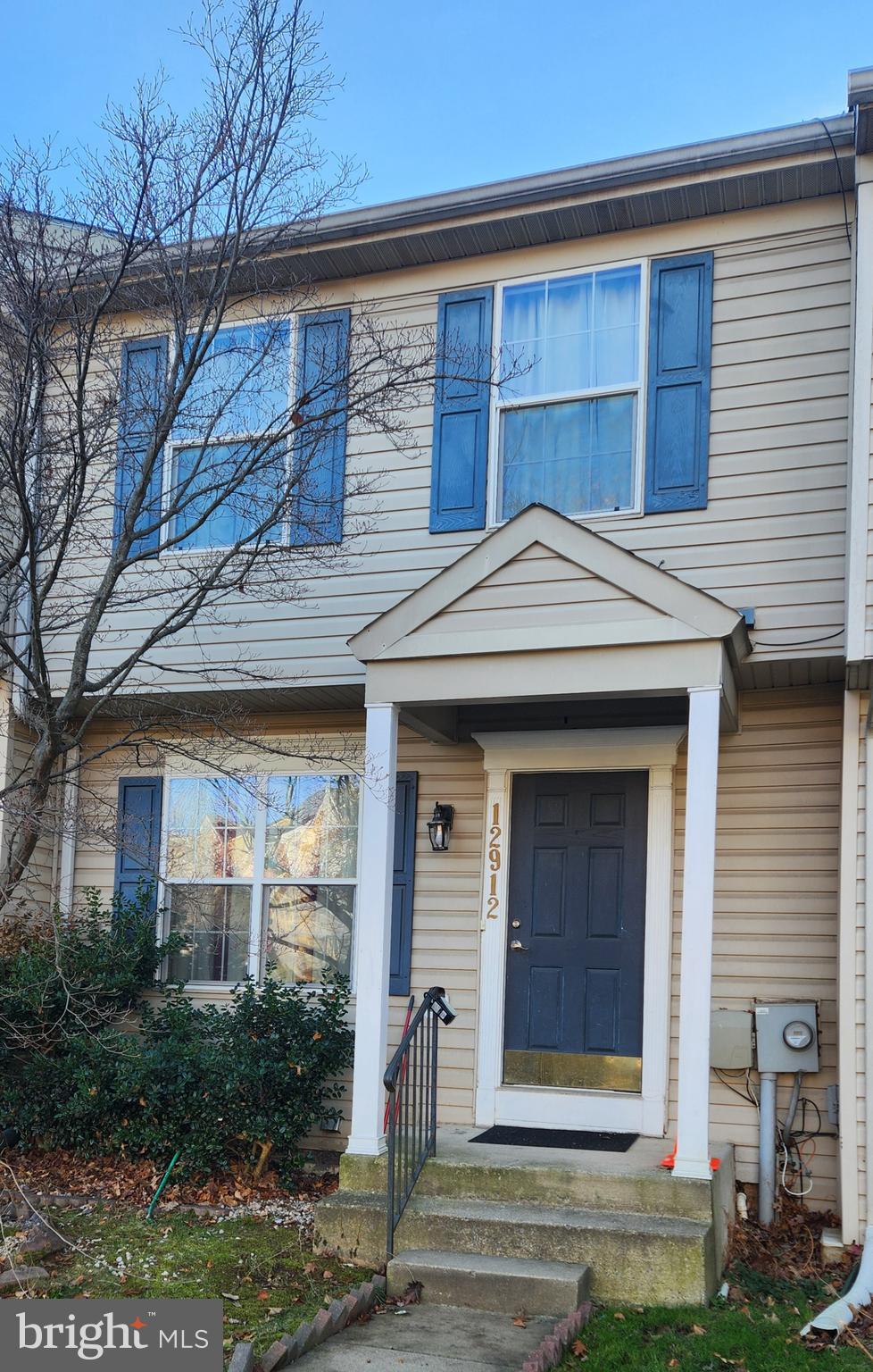 12912 Boggy Trail Way, Unit 55 Germantown, MD 20876 - Photo 2 of 27 a front view of a house with garden