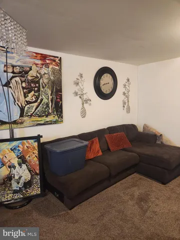 a living room with a couch and cabinets