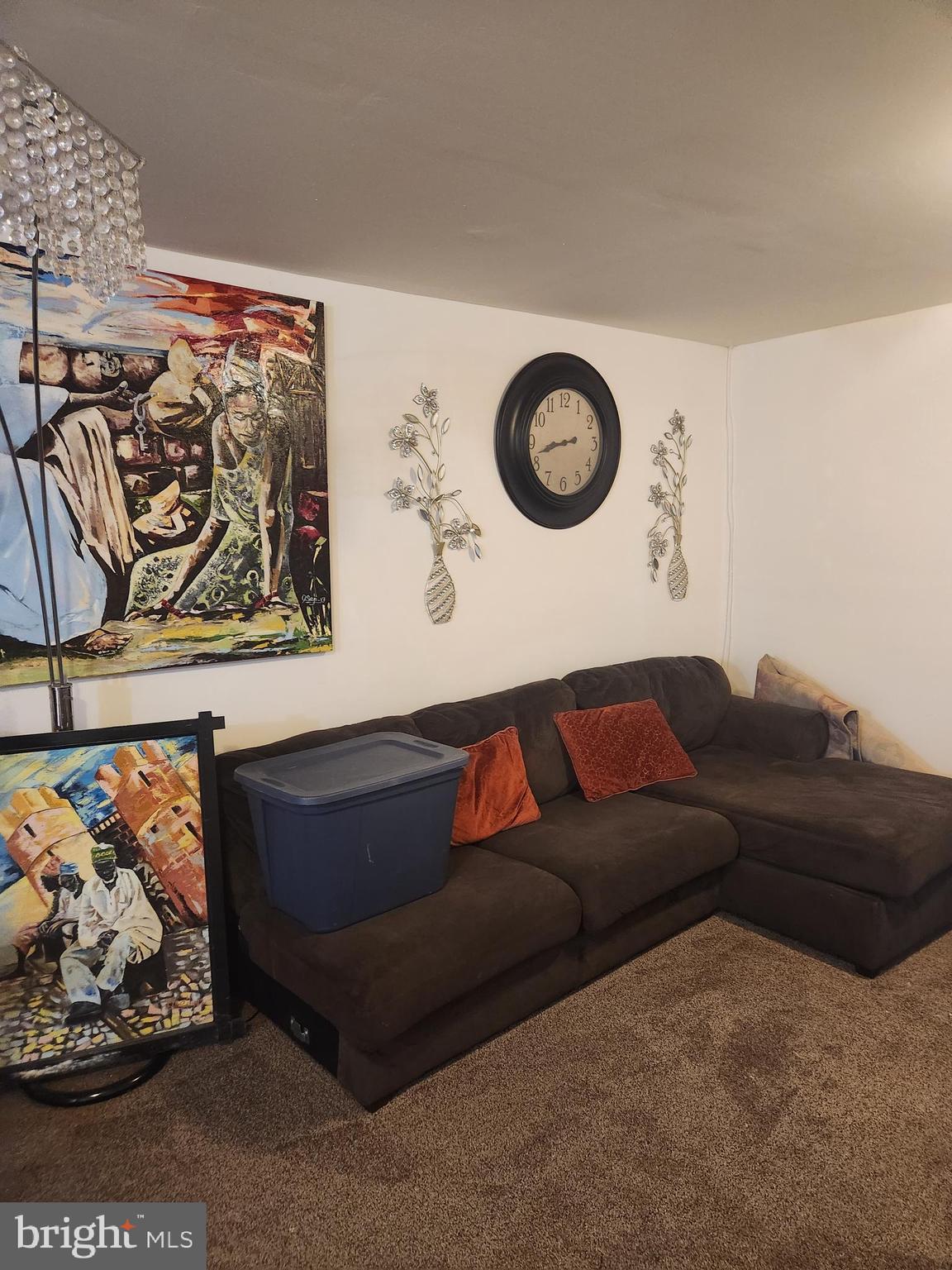 12912 Boggy Trail Way, Unit 55 Germantown, MD 20876 - Photo 24 of 27 a living room with a couch and cabinets