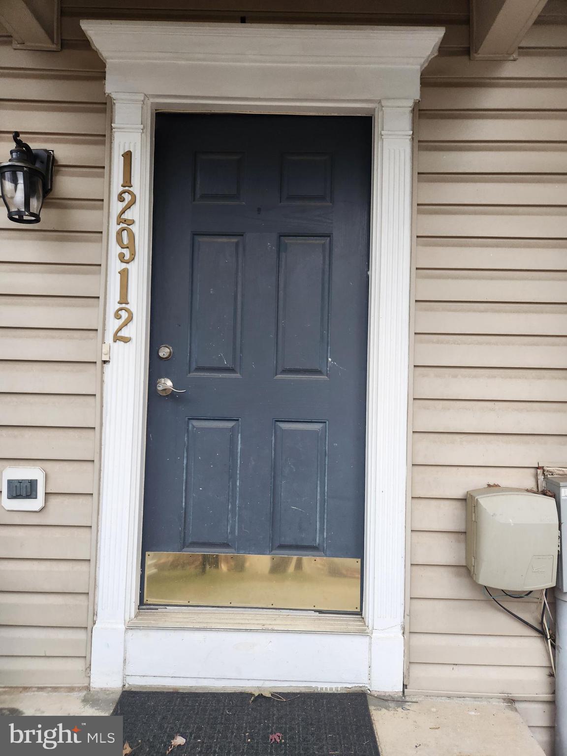 12912 Boggy Trail Way, Unit 55 Germantown, MD 20876 - Photo 3 of 27 a bathroom with a bathtub and shower
