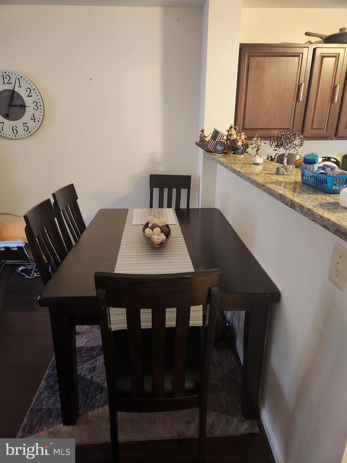 12912 Boggy Trail Way, Unit 55 Germantown, MD 20876 - Photo 9 of 27 a view of a dining room with furniture and wooden floor
