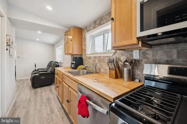 a kitchen with a stove and a sink