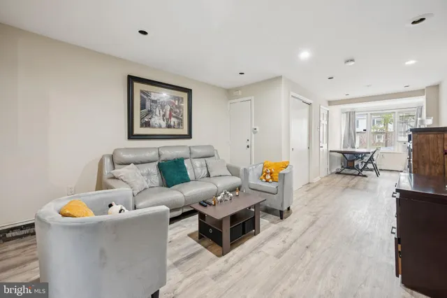 a living room with furniture and a table