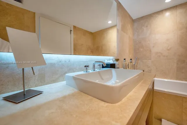 a view of a living room with furniture and wooden floor