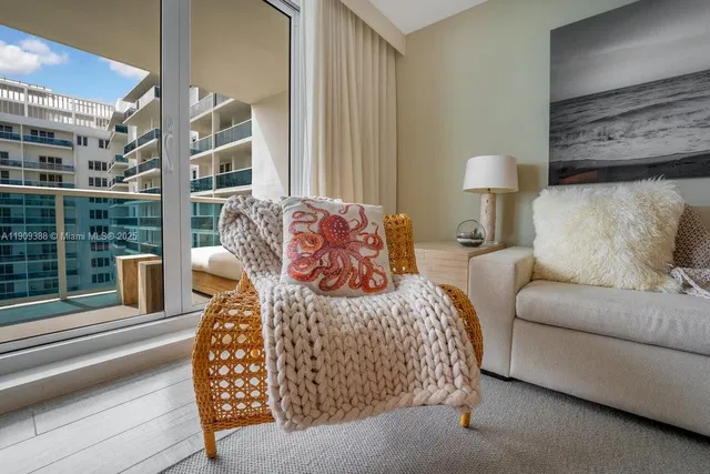 a bedroom with a bed and glass wall
