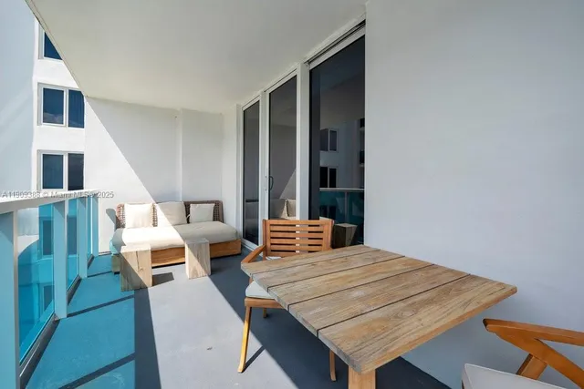 a view of a balcony with chairs