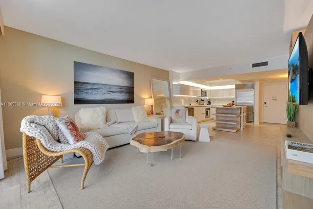 a living room with furniture and a table