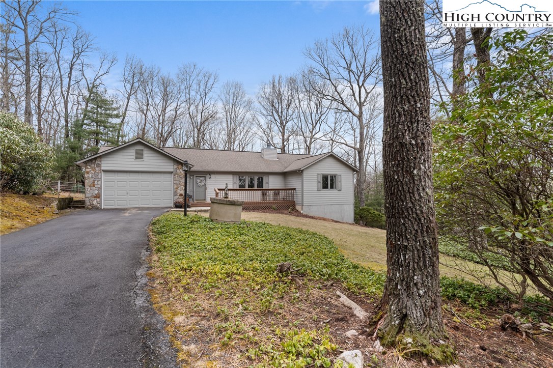 120 Village Road Glade Valley, NC 28627 - Photo 1 of 30 a front view of a house with garden