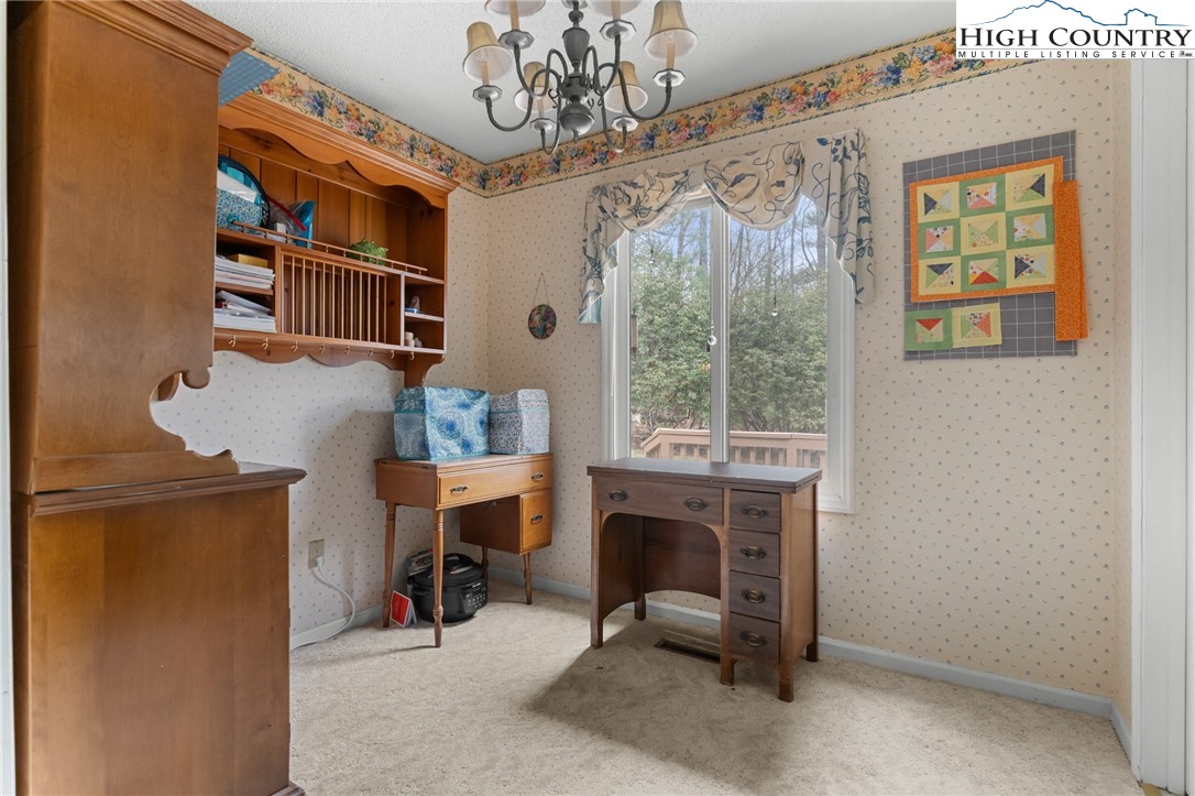 120 Village Road Glade Valley, NC 28627 - Photo 13 of 30 a view of a livingroom with furniture window and front door
