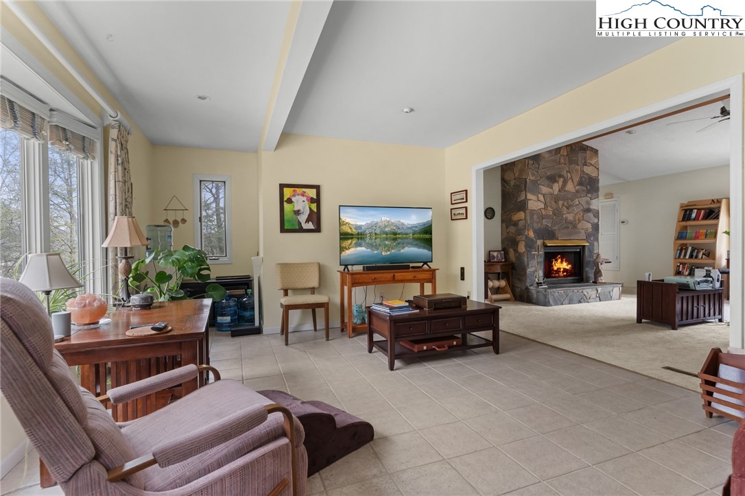 120 Village Road Glade Valley, NC 28627 - Photo 14 of 30 a living room with furniture and a flat screen tv