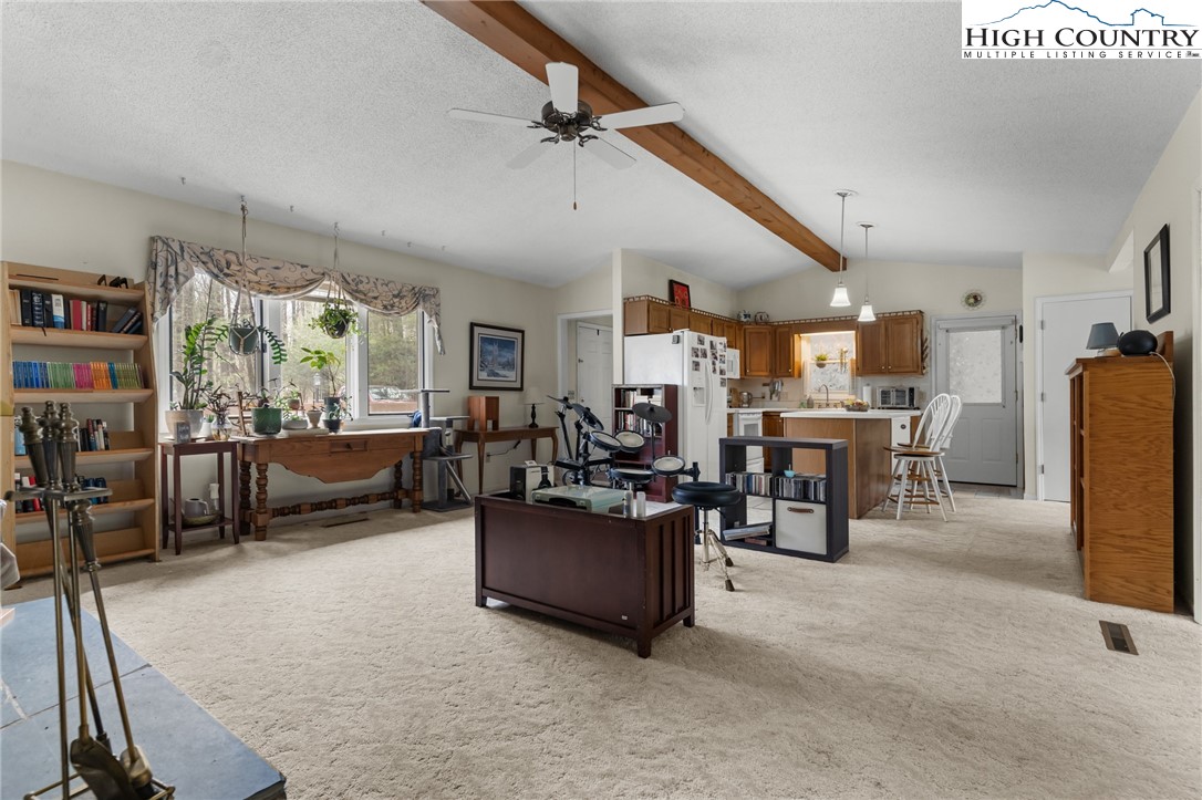 120 Village Road Glade Valley, NC 28627 - Photo 16 of 30 a living room with furniture and a flat screen tv