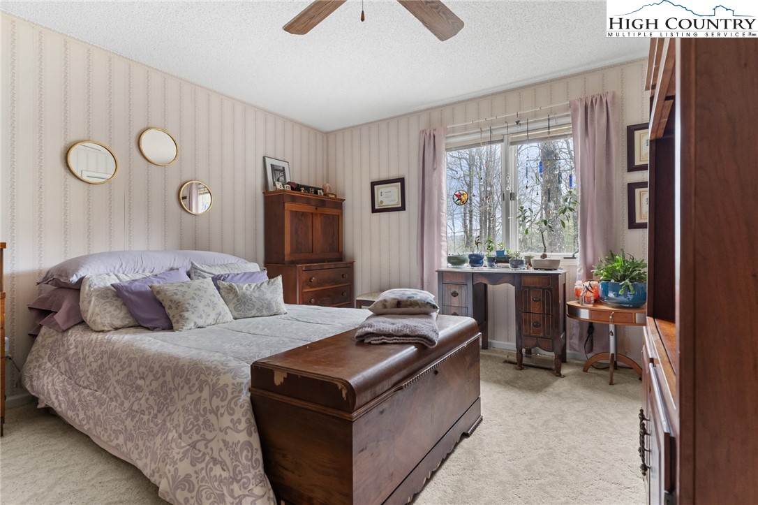 120 Village Road Glade Valley, NC 28627 - Photo 19 of 30 a living room with furniture and a large window