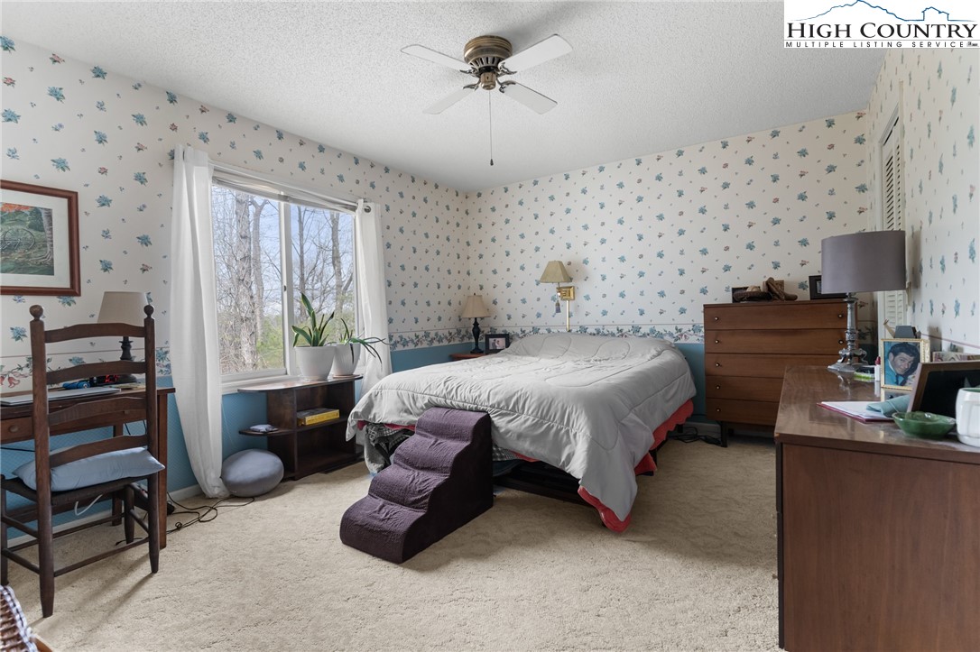 120 Village Road Glade Valley, NC 28627 - Photo 21 of 30 a bedroom with bed furniture and window