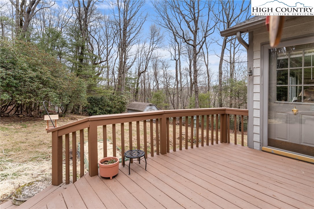 120 Village Road Glade Valley, NC 28627 - Photo 27 of 30 a view of balcony with wooden floor and outdoor seating