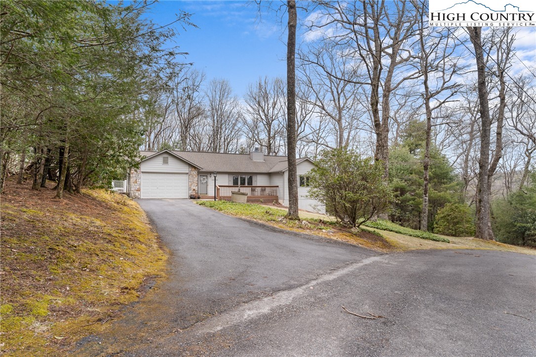120 Village Road Glade Valley, NC 28627 - Photo 30 of 30 a view of a house with large trees and a big yard
