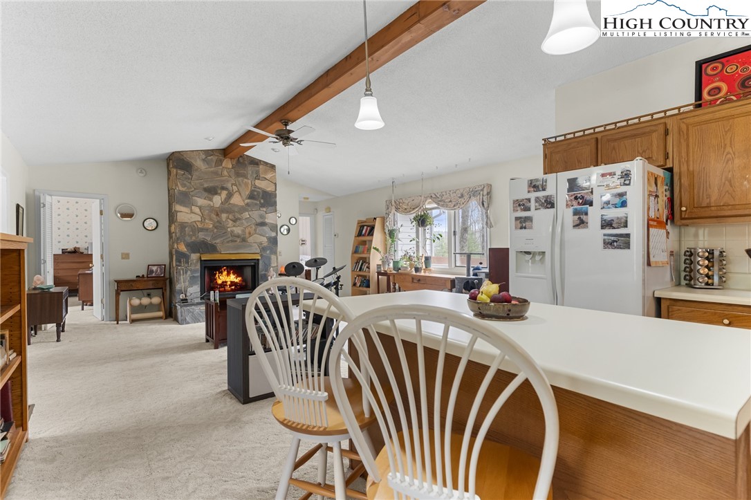 120 Village Road Glade Valley, NC 28627 - Photo 9 of 30 a view of a livingroom with furniture and a fireplace
