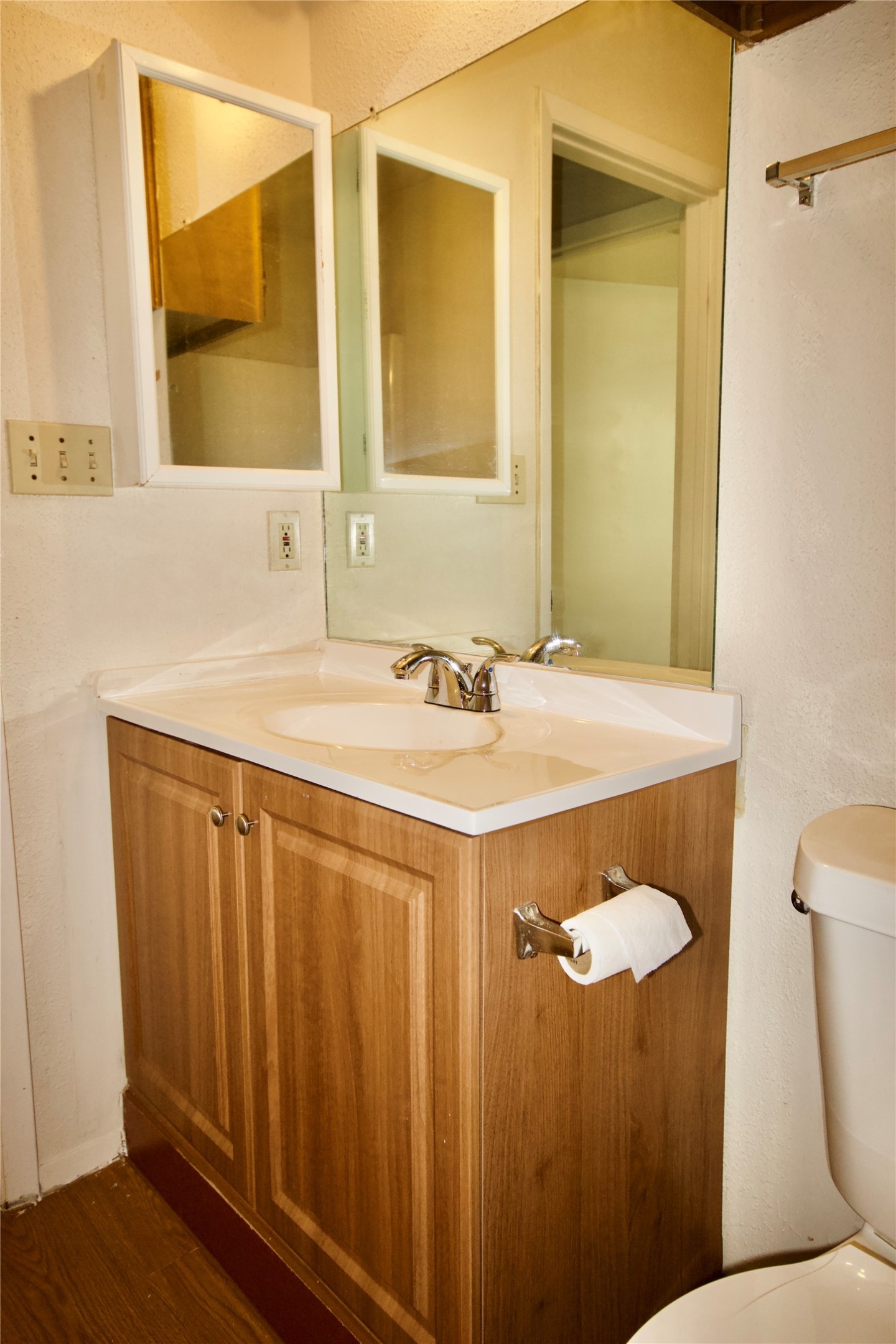 1405 D Camp Craft Road, Unit D West Lake Hills, TX 78746 - Photo 7 of 9 Half bathroom with vanity and dark wood-type flooring