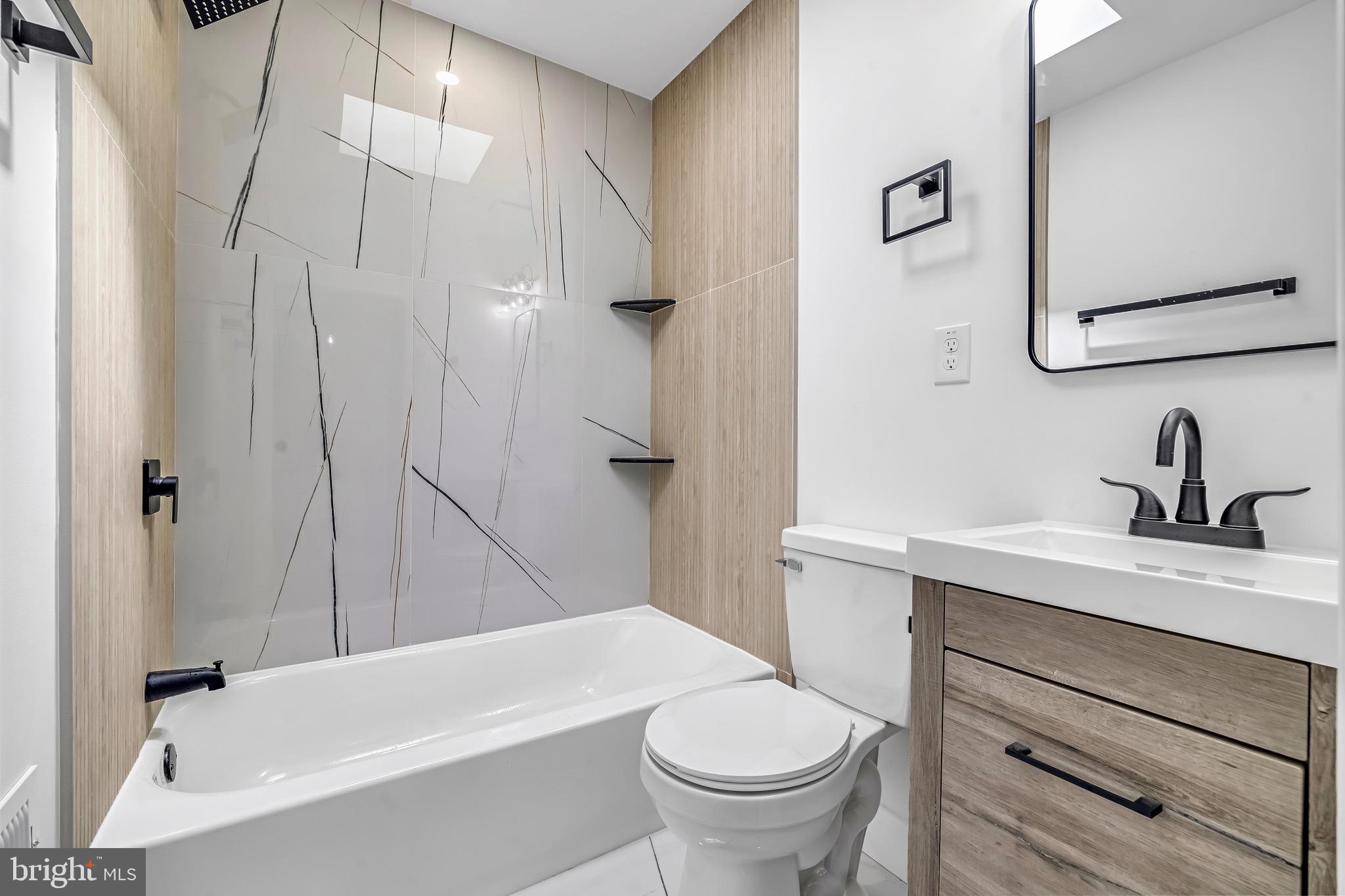 840 Benninghaus Road Baltimore, MD 21212 - Photo 18 of 30 a bathroom with a sink a toilet and a bathtub