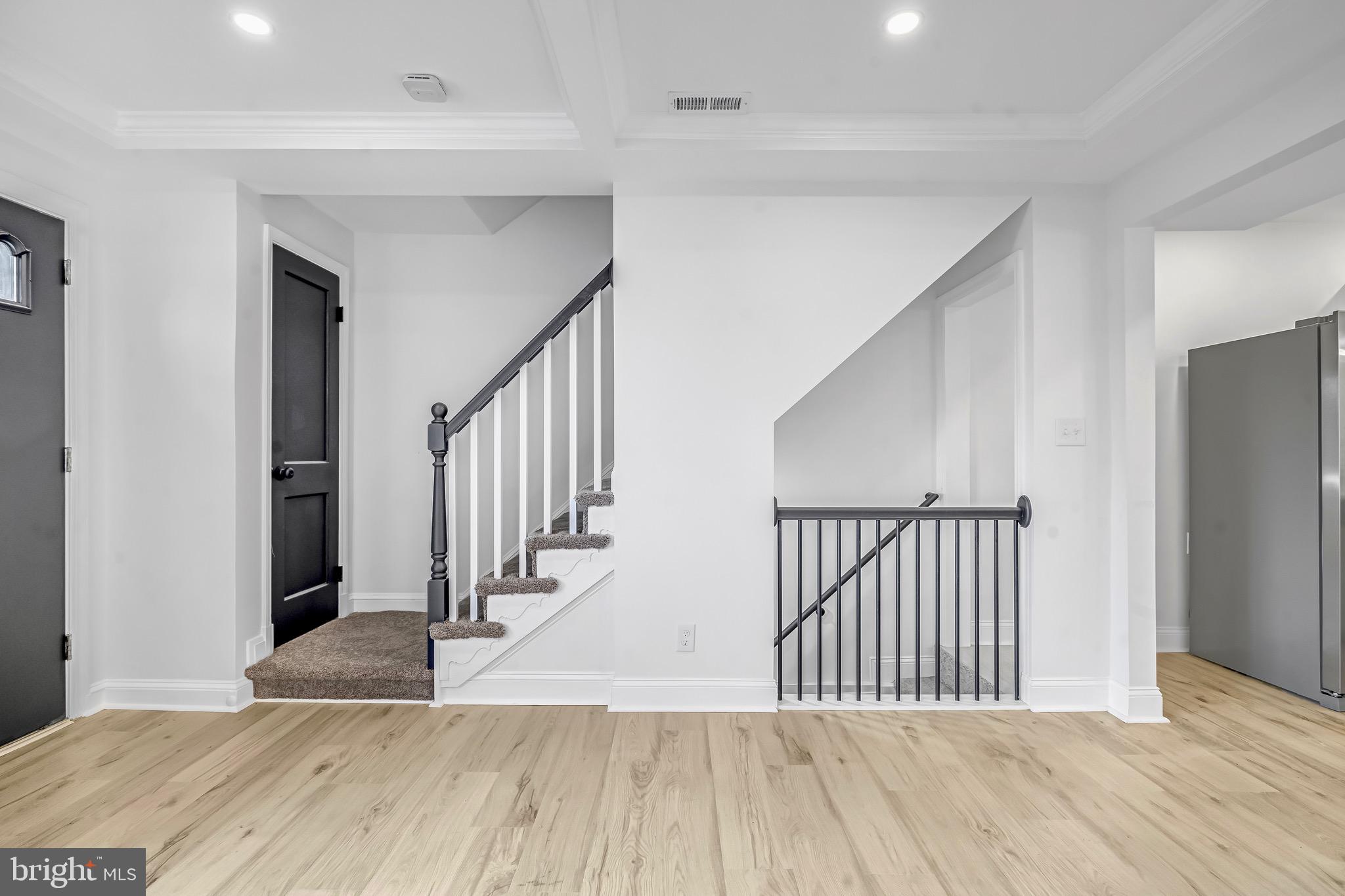 840 Benninghaus Road Baltimore, MD 21212 - Photo 19 of 30 a view of a hallway with wooden floor and stairs