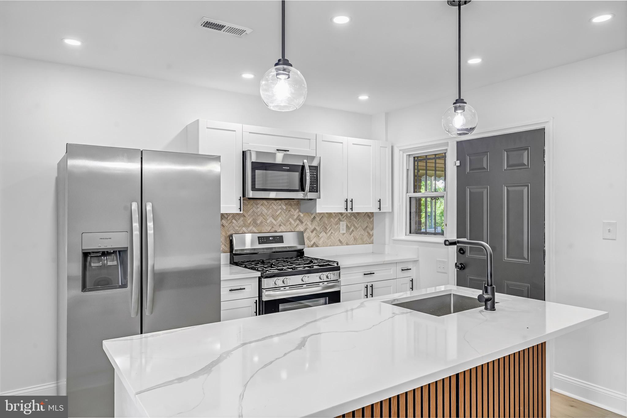 840 Benninghaus Road Baltimore, MD 21212 - Photo 2 of 30 a kitchen with stainless steel appliances a sink stove and refrigerator