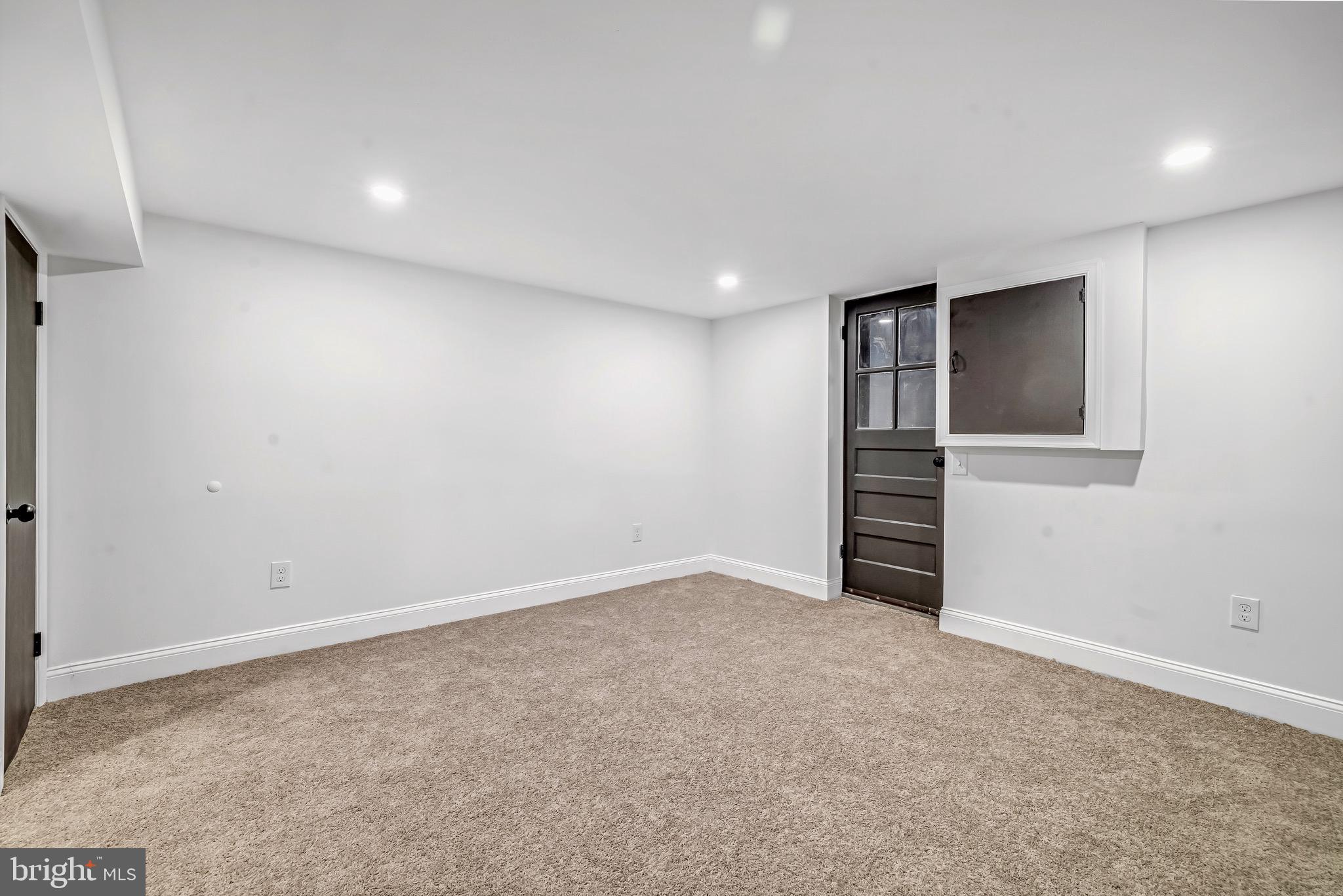 840 Benninghaus Road Baltimore, MD 21212 - Photo 25 of 30 an empty room with closet and windows