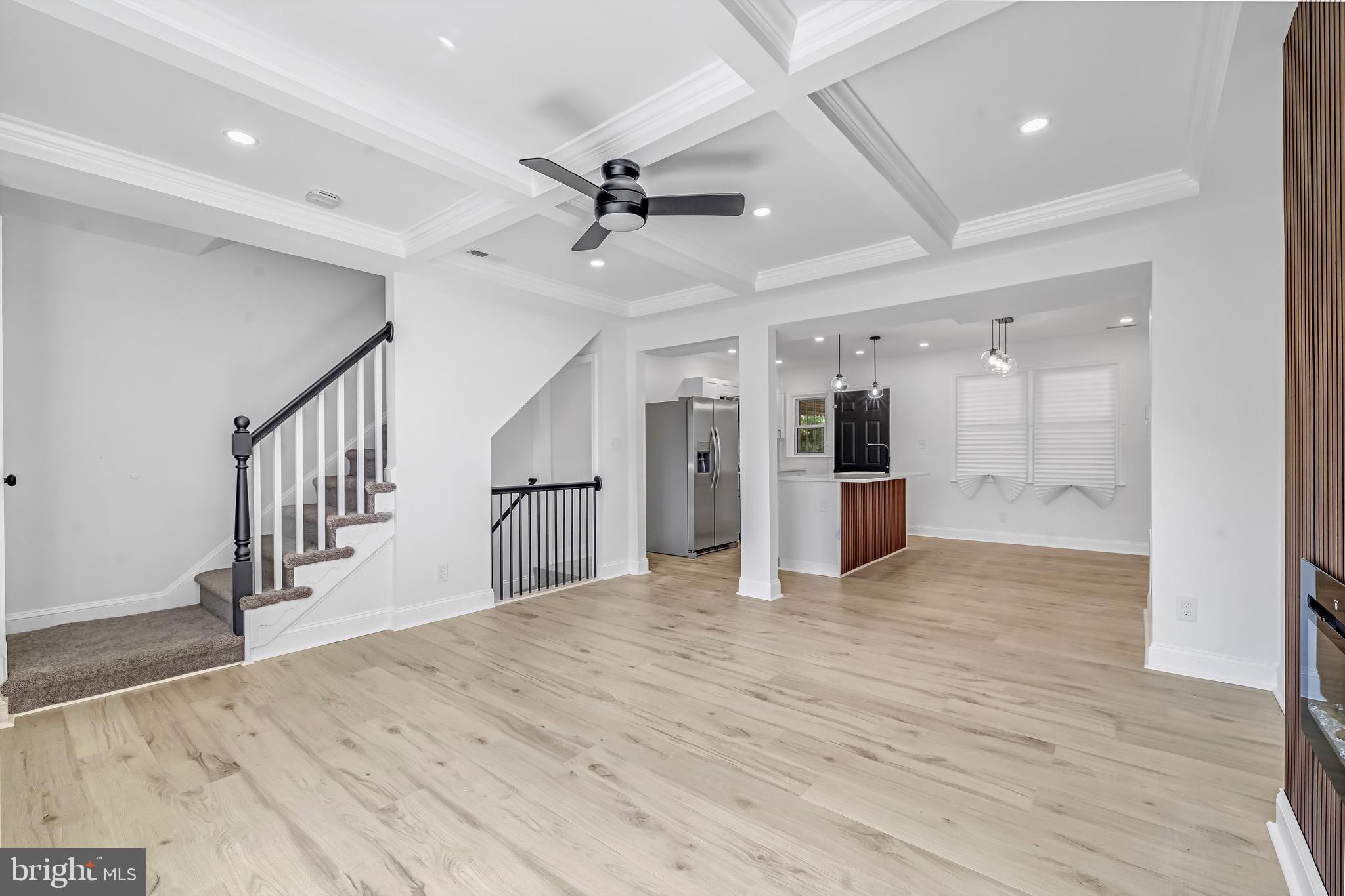 840 Benninghaus Road Baltimore, MD 21212 - Photo 6 of 30 a view of a hallway with wooden floor and staircase